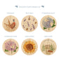 Six circular candle lids with watercolor-style nature illustrations are shown on a white background under the heading 'CHOOSE YOUR CANDLE LID'. Designs include Pheasant, Busy Bees, Hydrangea Blue, Hydrangea Pink, Sunflower, and New Home.