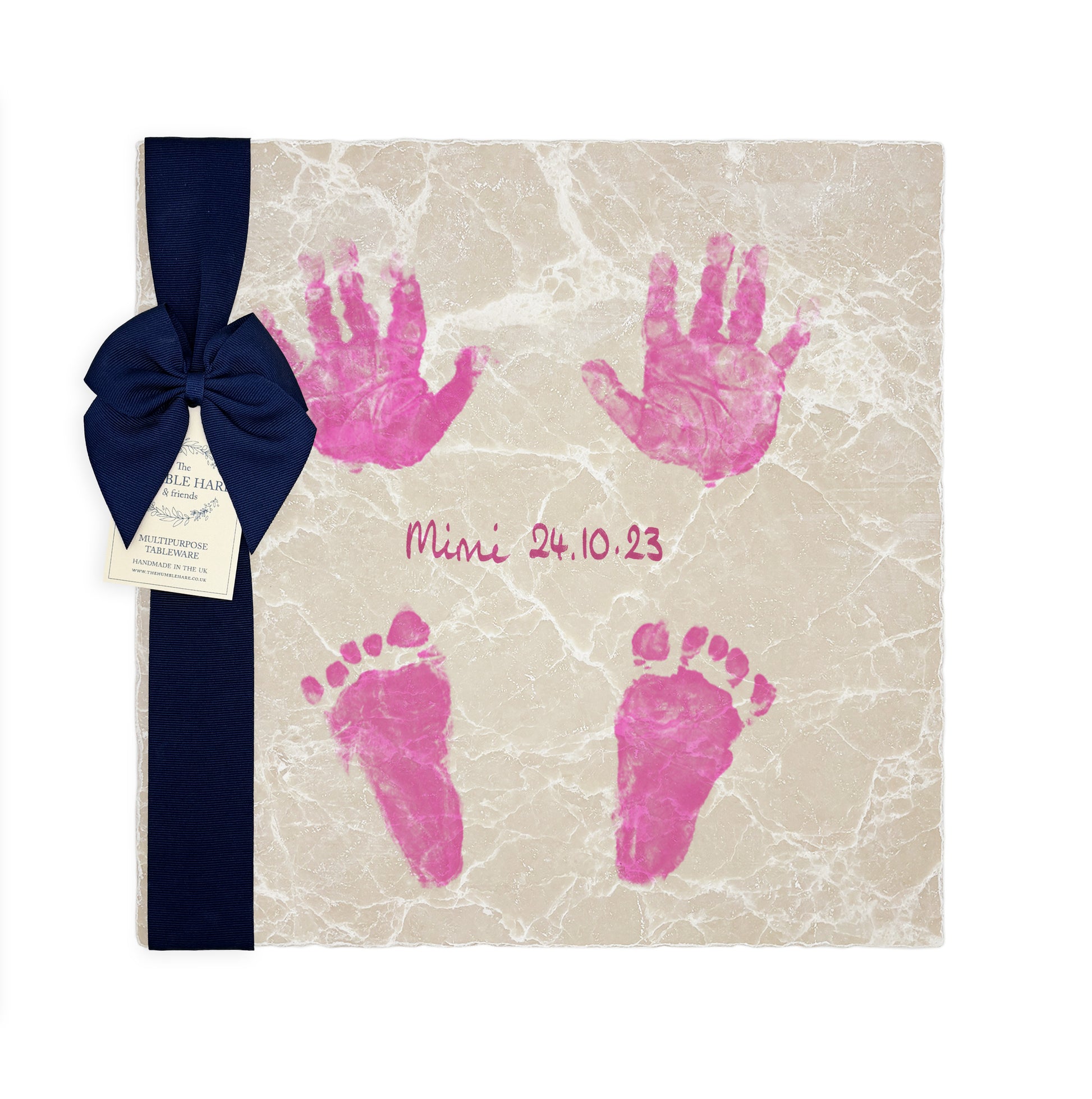 A personalised large marble picture tile featuring newborn baby hand and footprints, name and birthdate. Create the perfect keepsake for new parents and a meaningful gift for grandparents. The marble platter is packaged with a luxurious blue ribbon and tag.