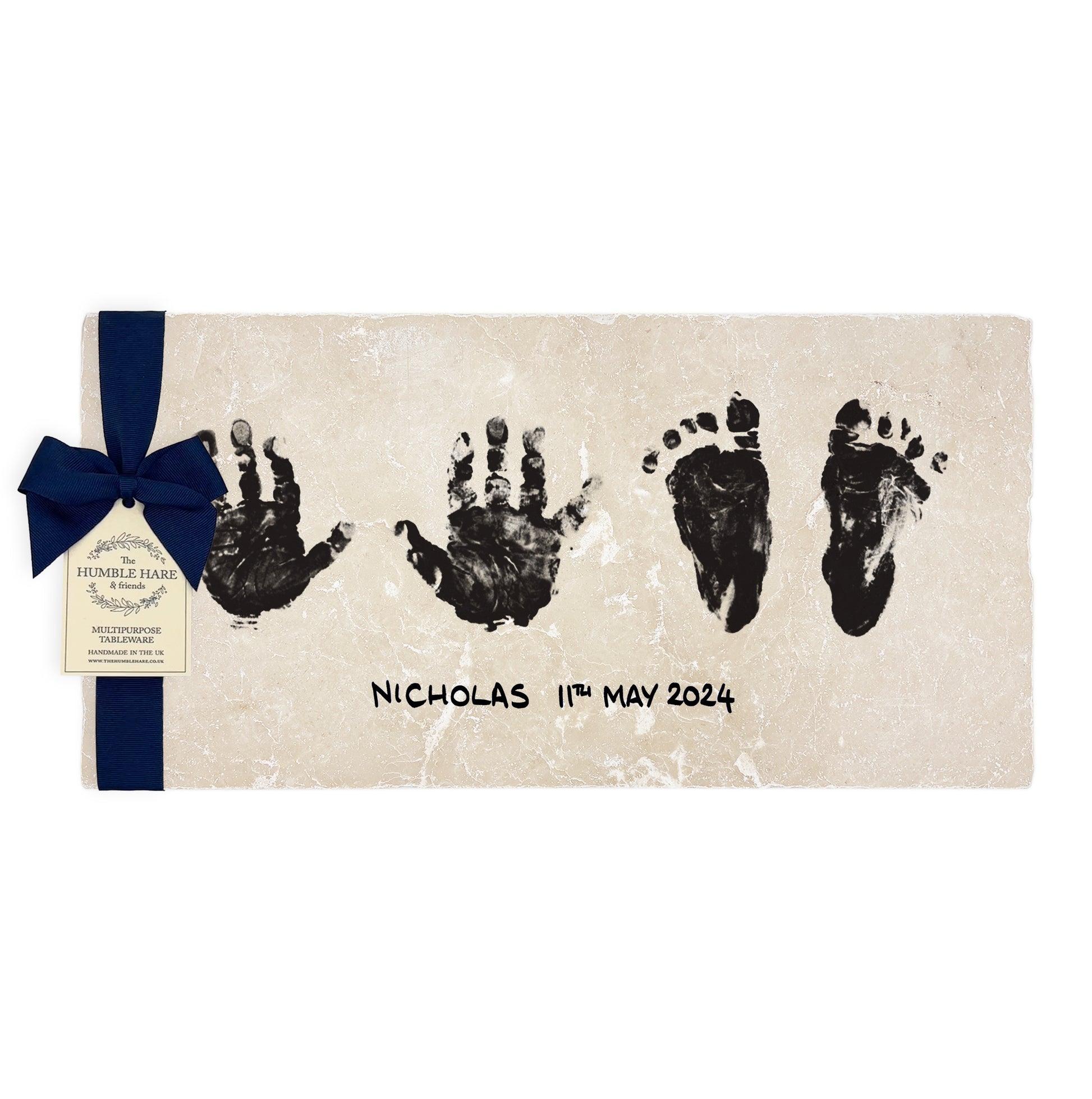 Celebrate cherished moments with a custom handmade picture tile featuring baby handprints, footprints, name and birthdate, the ideal personalised gift for any family occasion. The marble picture tile is packaged with a luxurious blue bow and tag.