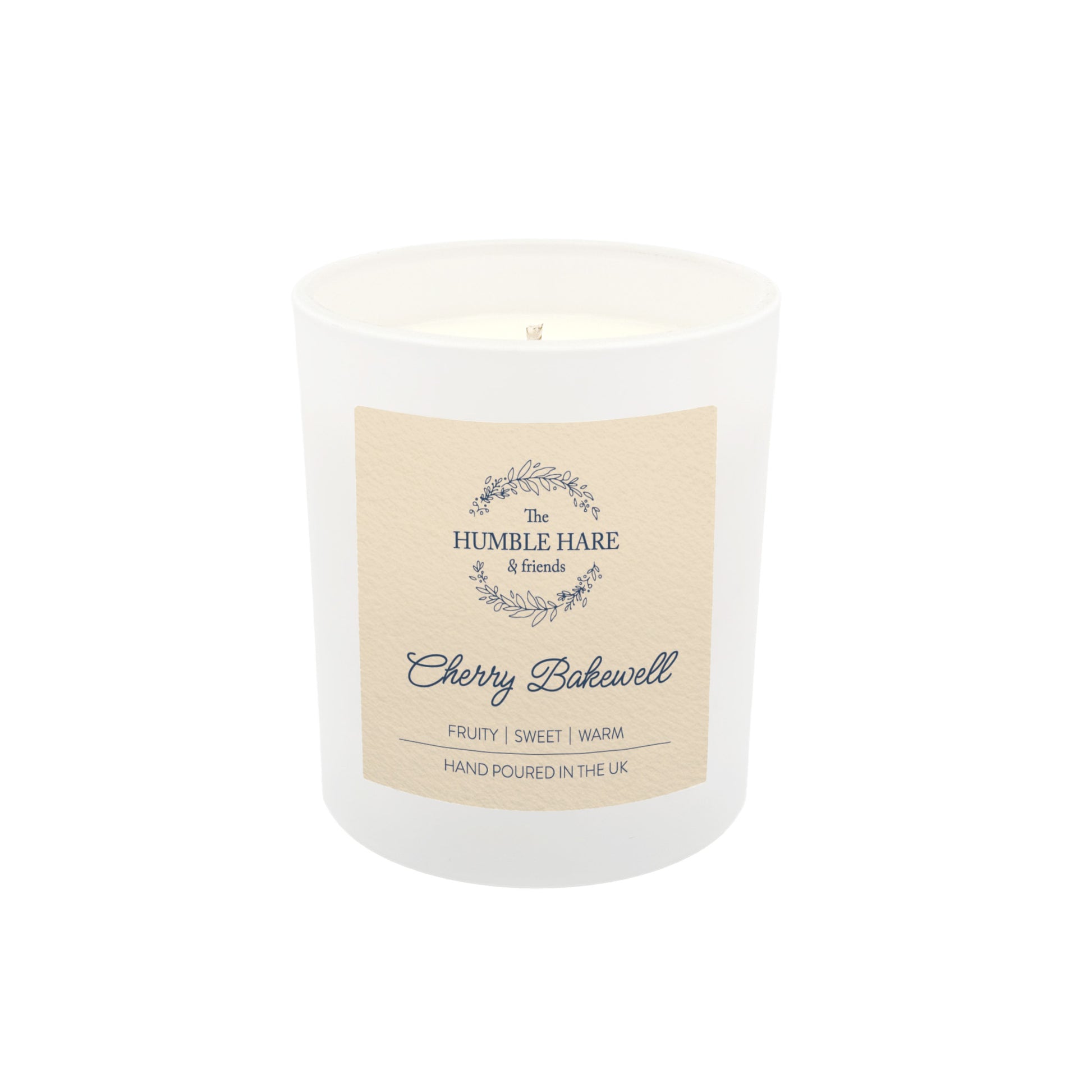 A white glass jar candle with a cream-colored label reading 'The Humble Hare & friends' and 'Cherry Bakewell', shown on a plain white background.