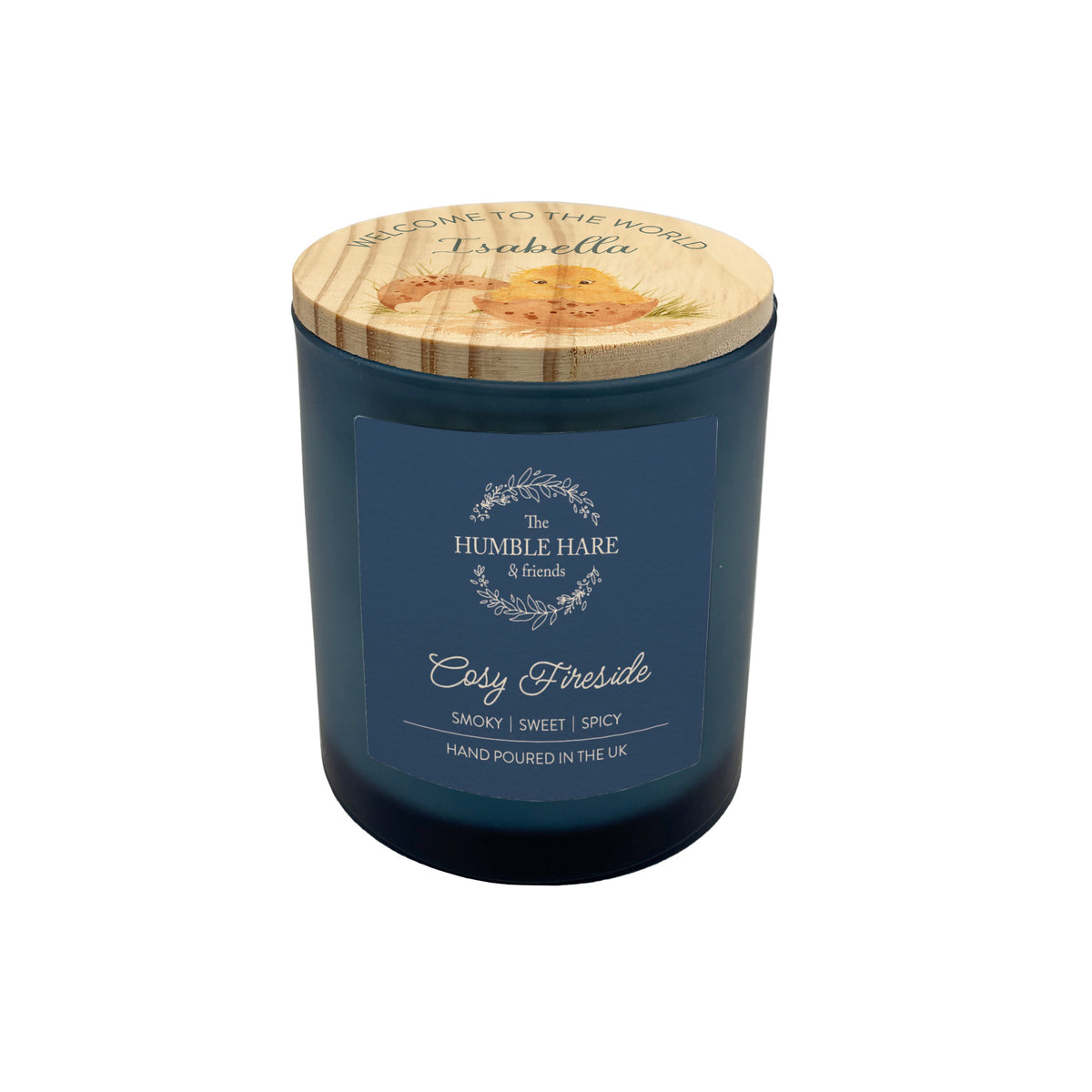 A jar candle with a dark blue glass body with a personalised light wood lid featuring personalised text and a watercolour illustration.