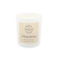 A white glass jar soy wax candle with a cream paper label. The candle is The Humble Hare's Cottage Garden, a floral clean washing scent.