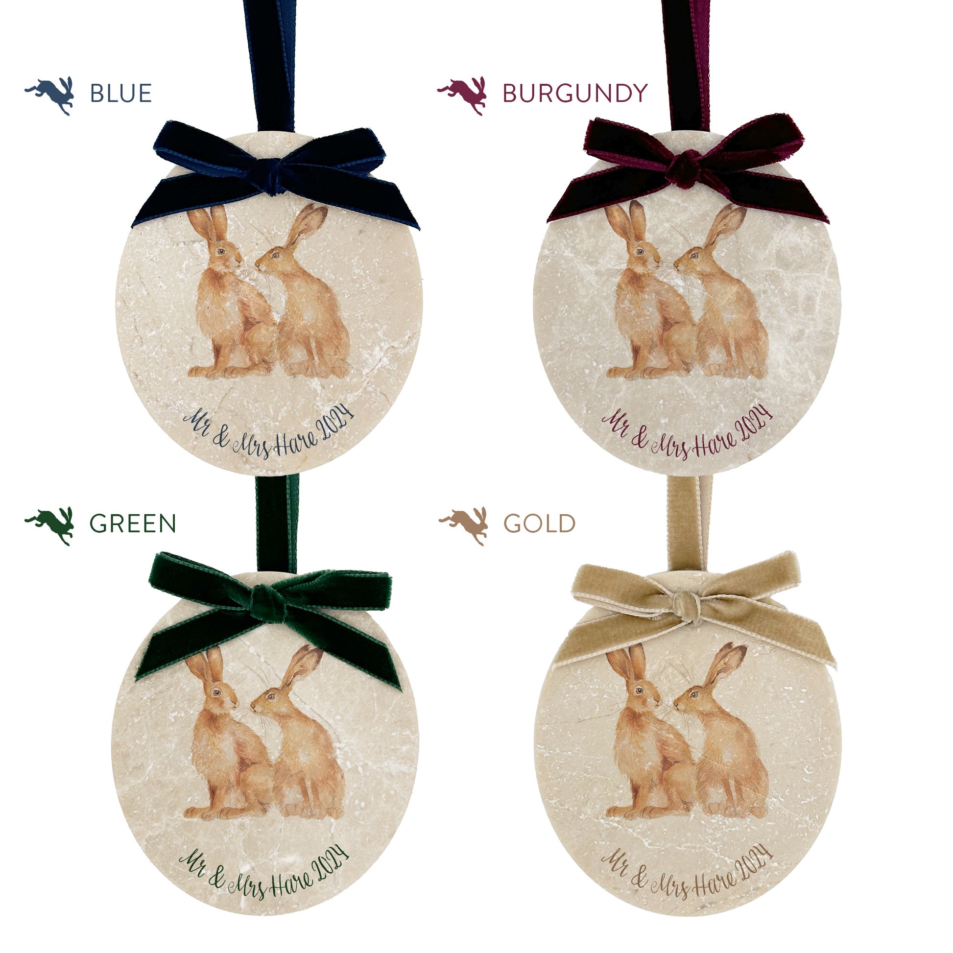 Four personalised oval shaped marble baubles showing a selection of velvet ribbon colour options. Choose from navy blue, burgundy red, forest green and champagne gold.