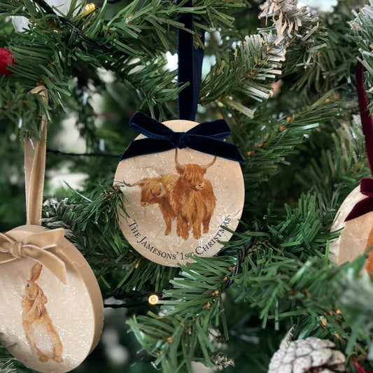 Add a touch of sophistication to your holiday decorations with our oval-shaped marble baubles. Featuring beautiful watercolour designs inspired by nature and finished with a velvet ribbon, these baubles can be personalised, making them a perfect addition to your Christmas collection.