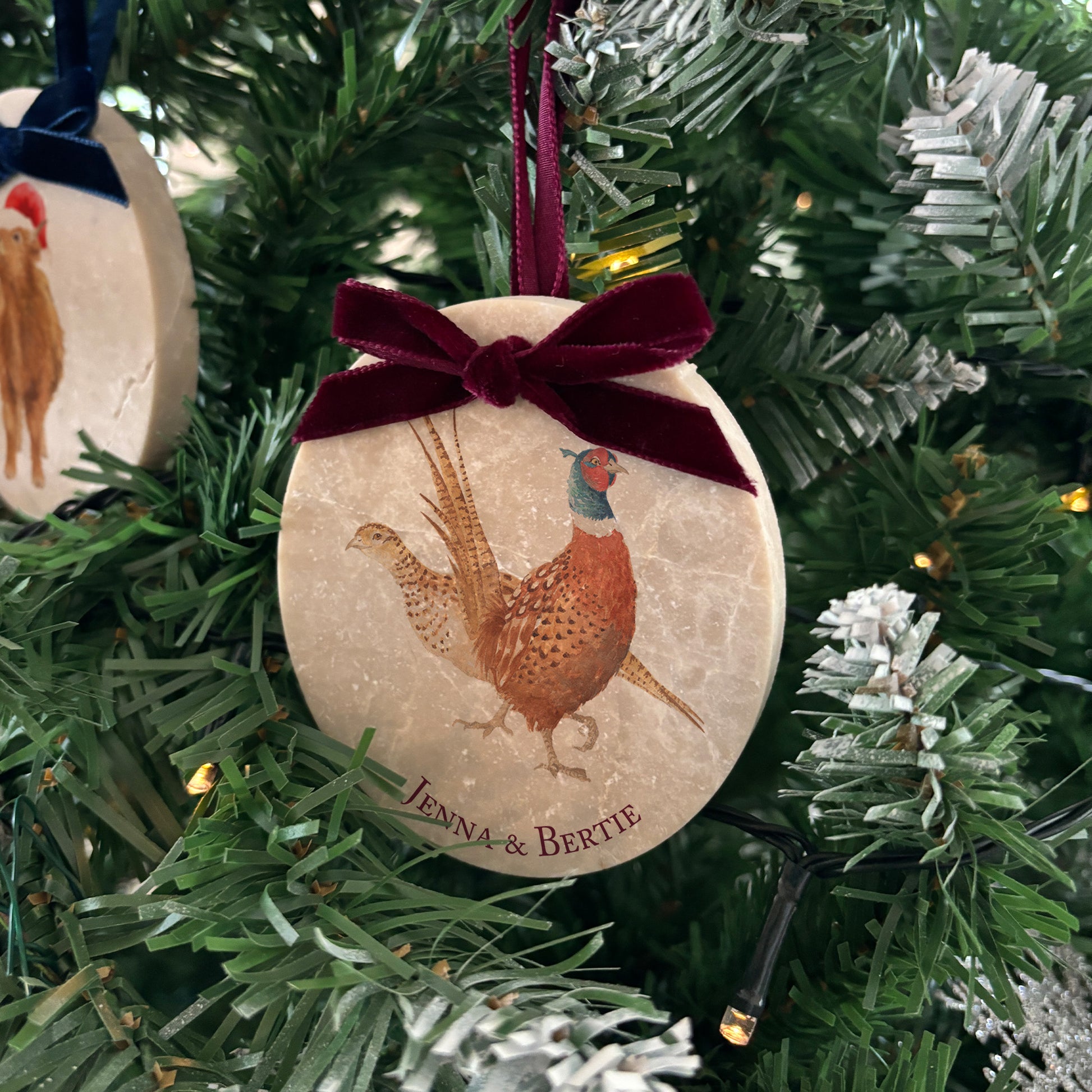 Transform your Christmas tree with our unique oval-shaped marble baubles, showcasing stunning watercolour artwork inspired by the natural world. Personalise each bauble to make it truly your own, and choose from a variety of velvet ribbon colours to suit your holiday décor.