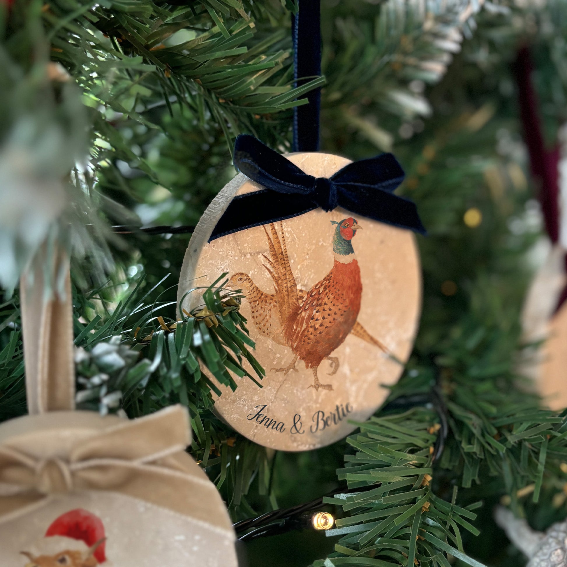 Bring the charm of the countryside into your home this holiday season with our oval-shaped marble baubles. Each features delicate watercolour designs, finished with a velvet ribbon in your favourite colour, and can be personalised to add a bespoke touch to your Christmas decorations.