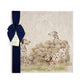 A large square marble platter featuring a  watercolour design of 3 dalmatian dogs playing fetch in the countryside. The platter is packaged with a luxurious blue gift bow.