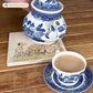 A square medium marble platter featuring a  watercolour design of 3 dalmatian dogs playing in the countryside. The platter is being used as a teapot stand.