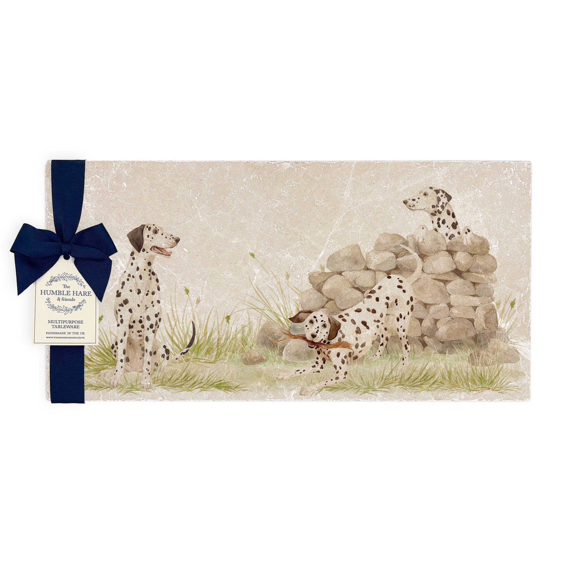 A rectangular marble sharing platter featuring a watercolour design of 3 dalmatian dogs playing fetch in the countryside. The platter is packaged with a luxurious blue gift bow.