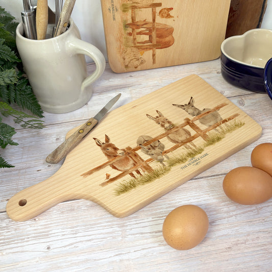 Donkey and Robin design on a wooden paddle chopping board 