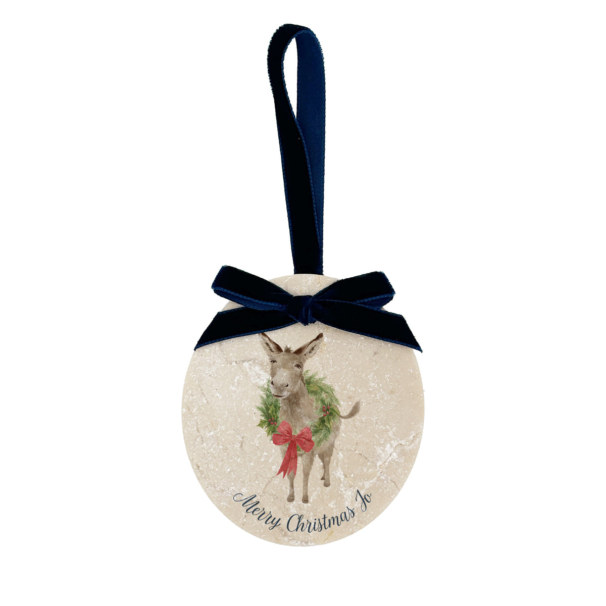 An oval marble Christmas ornament with a navy blue velvet ribbon loop and bow, featuring a vintage-style illustration of a donkey wearing a green wreath and red bow, with 'Merry Christmas' and a personalised name written at the bottom.