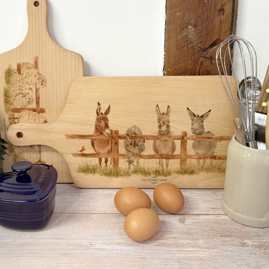 Donkey and Robin design on a flip wooden chopping board 
