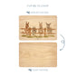 Wooden cutting board with a herd of donkeys illustration on one side and plain wood on the other, with text indicating which side to display and which to chop.
