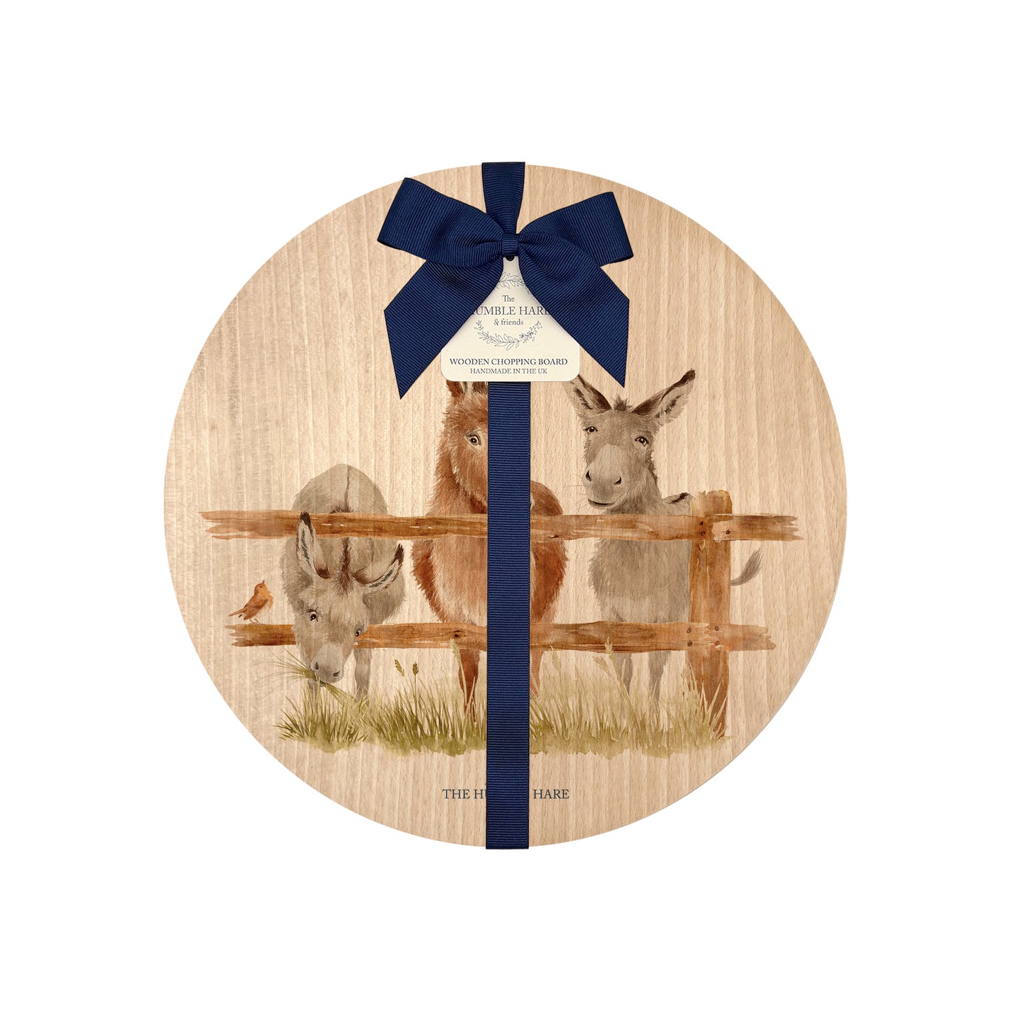 Round beech wood chopping board featuring a watercolour design of cheeky donkeys peering over their fence. The wooden board is finished with a blue gift ribbon and tag.