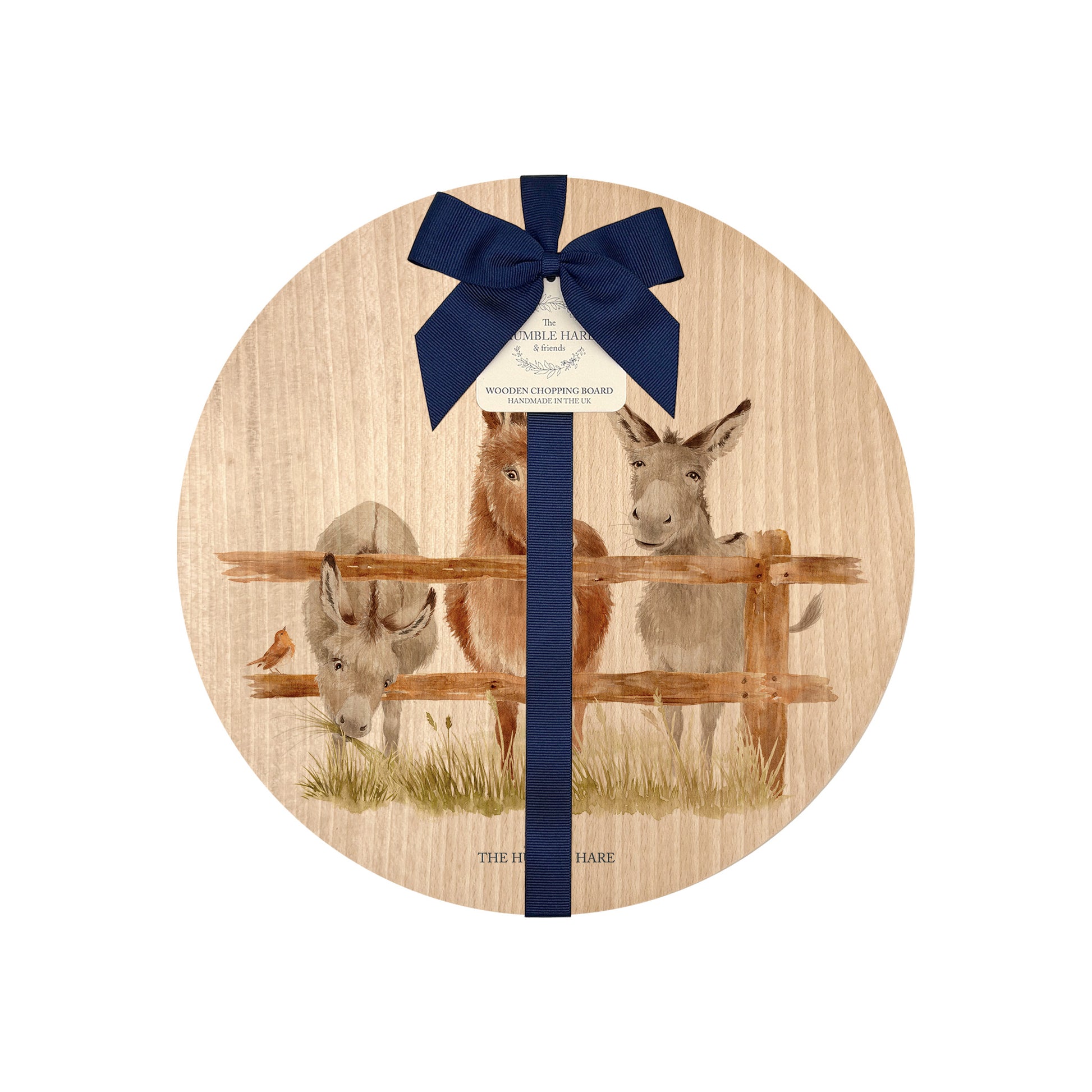 Round beech wood chopping board featuring a watercolour design of cheeky donkeys peering over their fence. The wooden board is finished with a blue gift ribbon and tag.