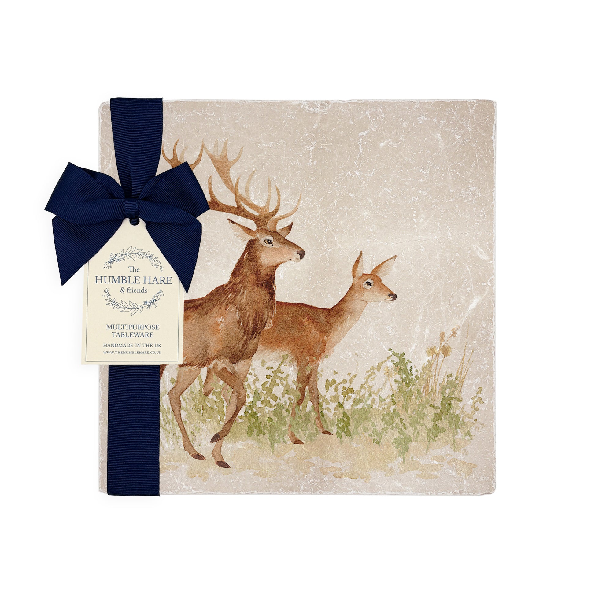 A medium square marble cheese board with a red deer stag and hind watercolour design, packaged with a luxurious dark blue bow and branded gift tag.