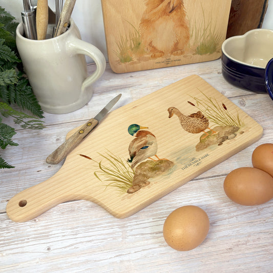 Handmade paddle board in Beech wood, featuring a water colour Mallard Ducks design with a hand tied luxury blue ribbon. perfect chopping board, charcuterie board, serving board and chopping board. 