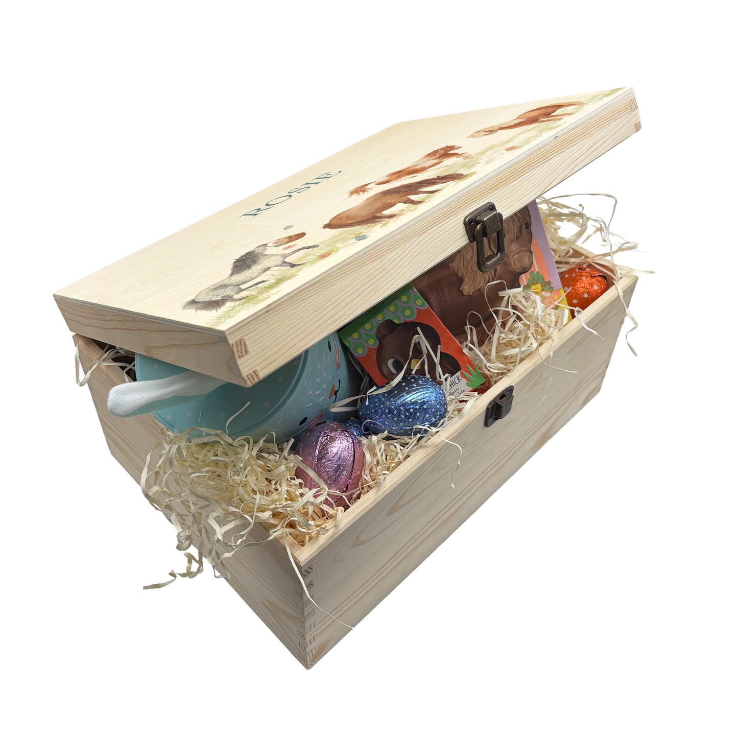 This Easter wooden gift box box has 4 Shetland ponies running around a spring meadow. One Shetland is swinging a bucket full of pastel easter eggs which has flung all over the meadow. another is bucking and having lots of fun another is grazing and the other is stood watching. These easter boxes are great for gifting and filling full of easter treats for your loved ones, children, parents and friends. Great keeps sake to keep. This box is full of easter treats and biscuits, great ideas for the perfect gift