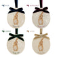 Four personalised oval shaped marble baubles showing a selection of velvet ribbon colour options. Choose from navy blue, burgundy red, forest green and champagne gold.