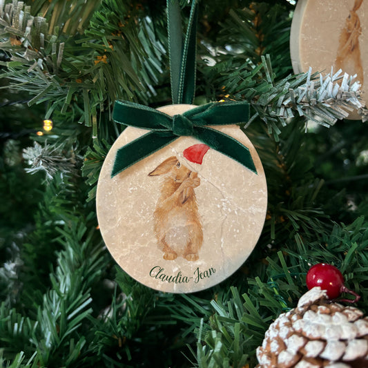 Bring the charm of the countryside into your home this holiday season with our oval-shaped marble baubles. Each features delicate watercolour designs, finished with a velvet ribbon in your favourite colour, and can be personalised to add a bespoke touch to your Christmas decorations.