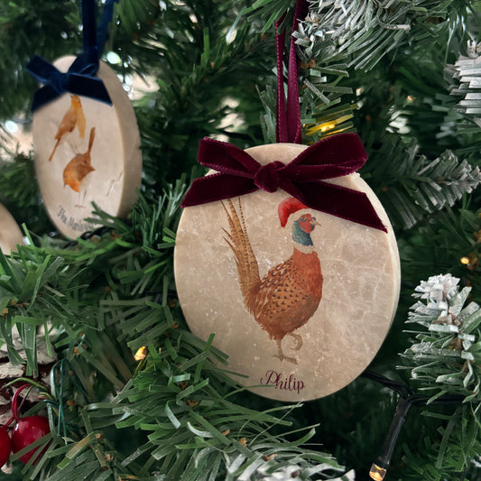 Our oval-shaped marble Christmas baubles combine elegant watercolour designs with a personalised touch. Available in various velvet ribbon colours, these beautifully crafted baubles are the perfect way to add a bespoke, nature-inspired accent to your festive décor.