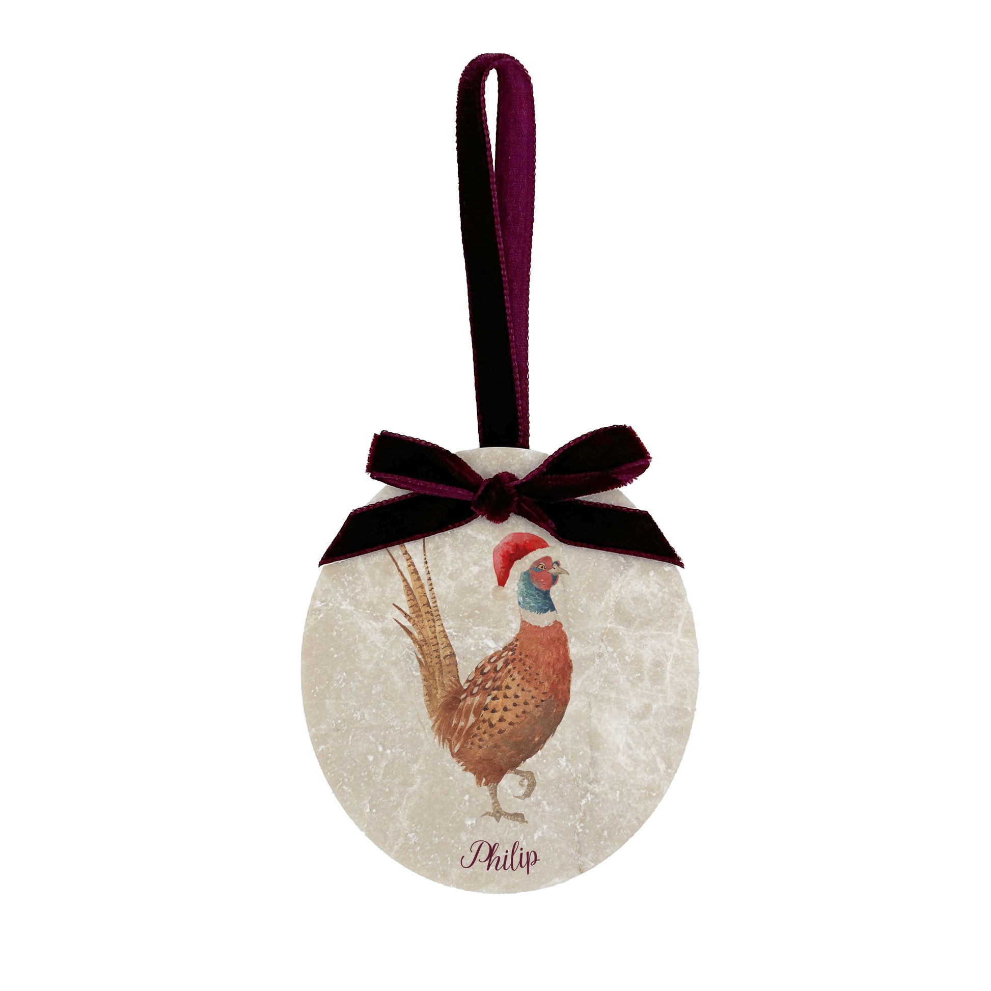 An oval marble bauble featuring a watercolour pheasant, personalised with your choice of text to create a Christmas decoration unique to you! The bauble is finished with a velvet ribbon.