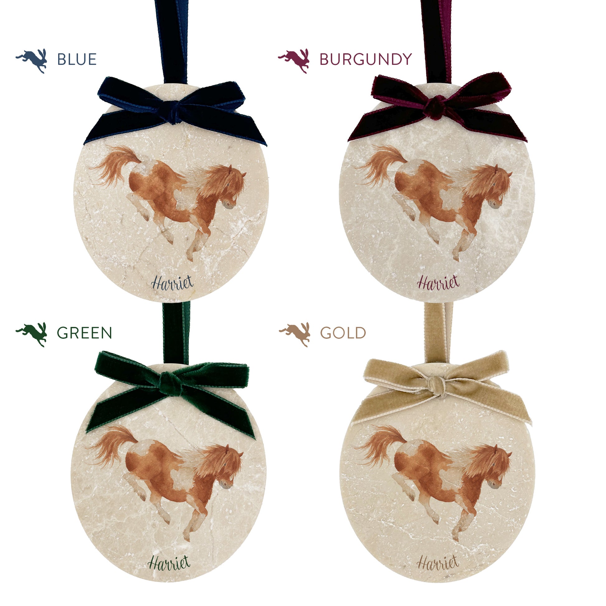 Four personalised oval shaped marble baubles showing a selection of velvet ribbon colour options. Choose from navy blue, burgundy red, forest green and champagne gold.