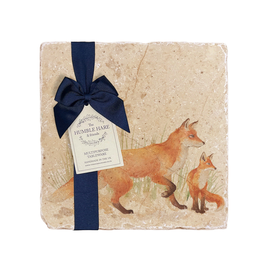 A medium multipurpose marble platter with a fox and fox cub design, packaged with a luxurious dark blue bow and branded gift tag.