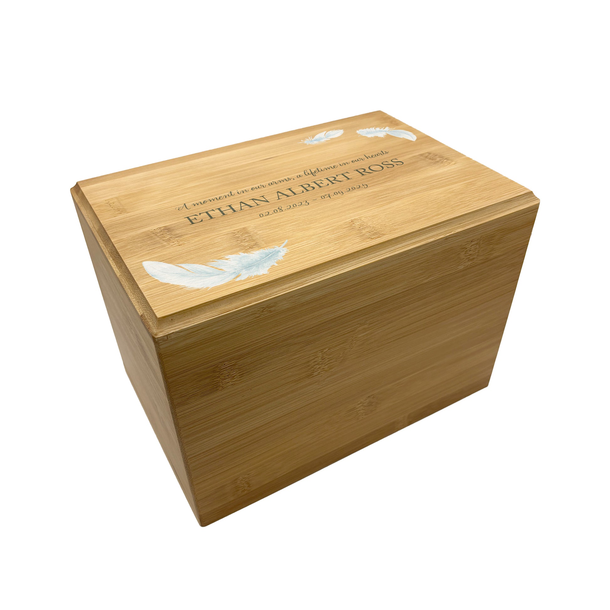 A beautifully crafted solid Bamboo wooden urn, personalised and finished with a soft watercolour Feather design, Thoughtfully made for either display or burial, this personalised urn can be customised to create a meaningful memorial. Perfect for holding ashes of a loved one or a beloved pet, it serves as a comforting tribute and keepsake. 