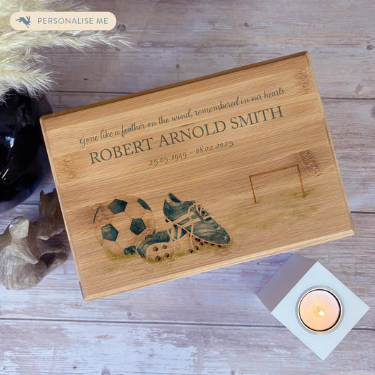 A beautifully crafted solid Bamboo wooden urn, personalised and finished with a soft watercolour design of Football boots, goal and ball. Perfect for the football lover- Great for Dad, Grandad, Brother, Son, Uncle.  Thoughtfully made for either display or burial, this personalised urn can be customised to create a meaningful memorial. Perfect for holding ashes of a loved one or a beloved pet, it serves as a comforting tribute and keepsake. 