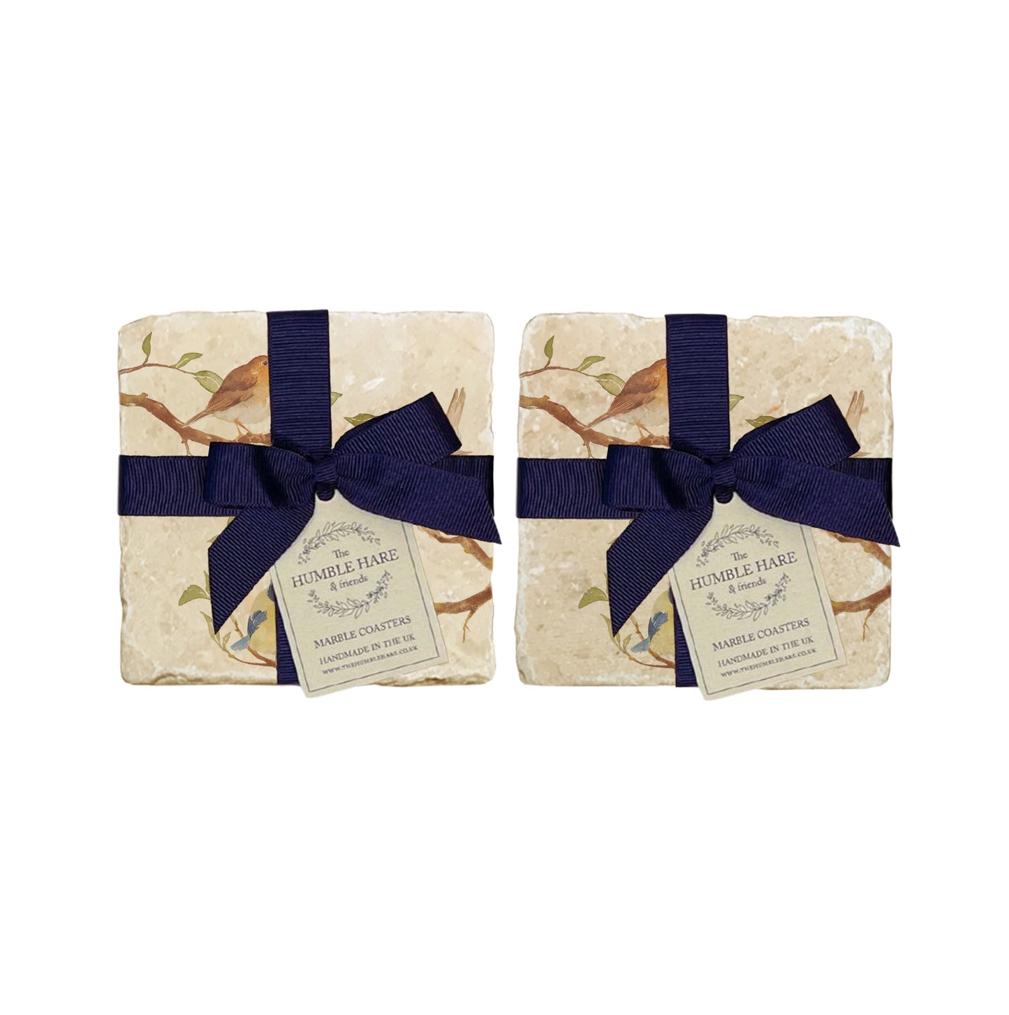 A set of 4 handmade marble coasters packaged in 2 pairs, with a luxurious dark blue bow and gift tag.