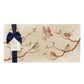 A multipurpose marble platter with a British garden birds on branches design, packaged with a luxurious dark blue bow and branded gift tag.