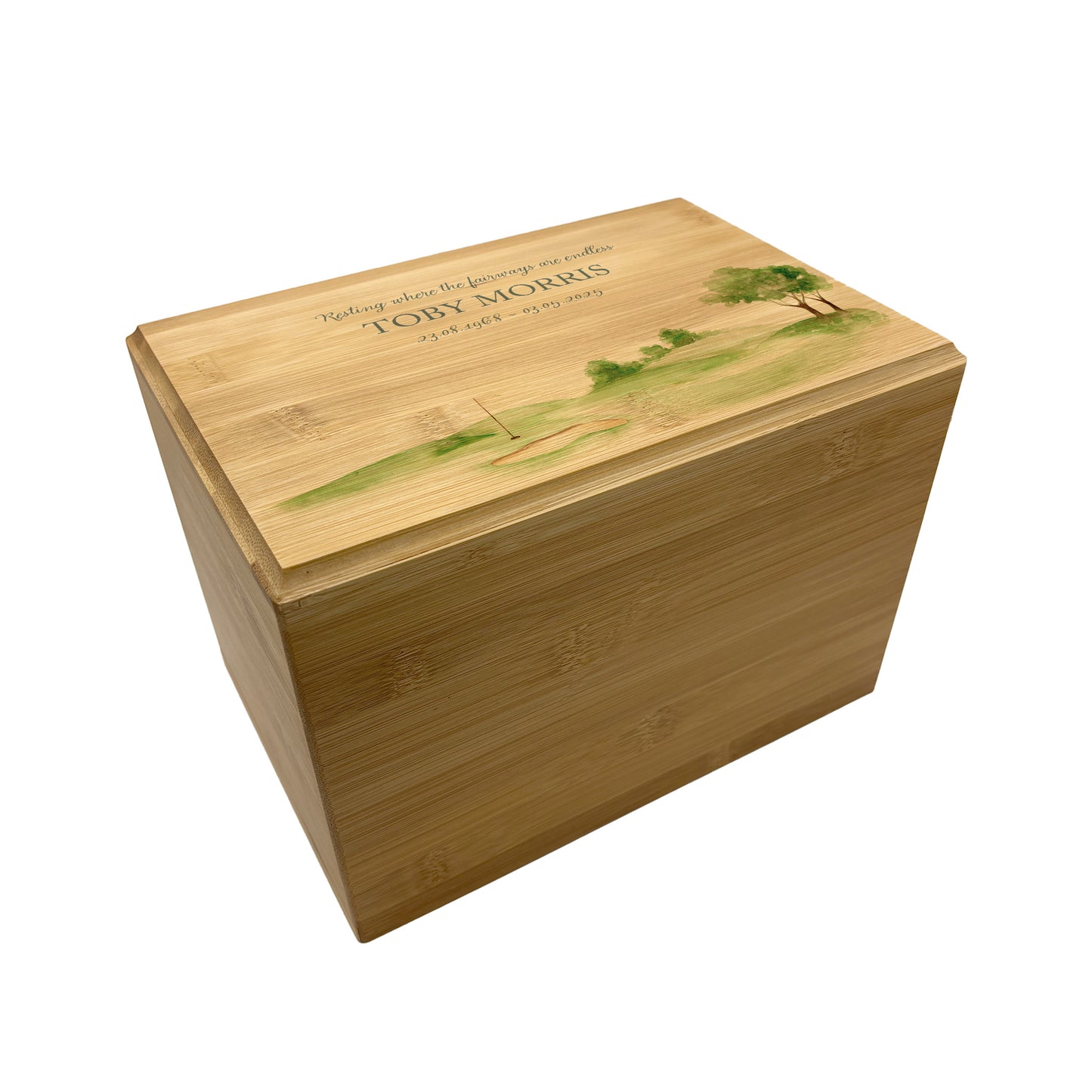 A beautifully crafted solid Bamboo wooden urn, personalised and finished with a soft watercolour design of a golf green, Perfect for the Golf lover- Great for Dad, Grandad, Brother, Son, Uncle.  Thoughtfully made for either display or burial, this personalised urn can be customised to create a meaningful memorial. Perfect for holding ashes of a loved one or a beloved pet, it serves as a comforting tribute and keepsake. 