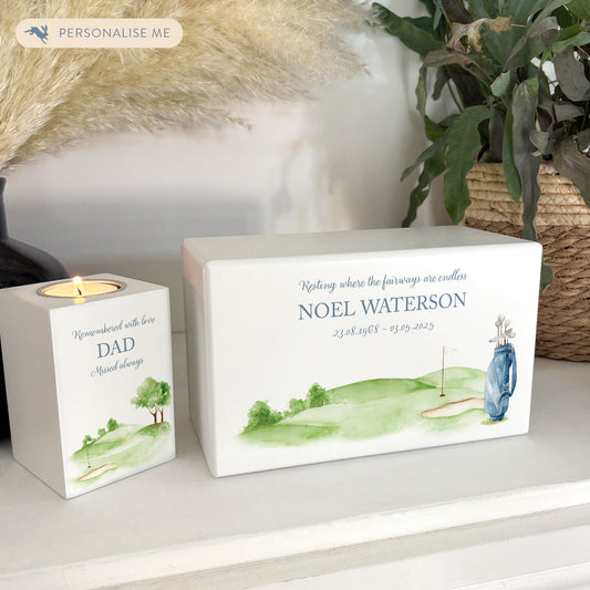 Luxury solid wooden white painted Urn featuring a Golf Bag memorial, capturing your loved ones hobby. A watercolour illustration, our urns and Caskets for displaying or burying ashes. Customisable and can be personalised. Perfect funeral memory keepsake urn, for storing ashes for humans and pets. 
