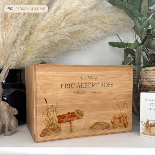 A beautifully crafted solid Bamboo wooden urn, personalised and finished with a soft watercolour design of a fishing scene,  Perfect for the fishing lover- Great for Dad, Grandad, Brother, Son, Uncle.  Thoughtfully made for either display or burial, this personalised urn can be customised to create a meaningful memorial. Perfect for holding ashes of a loved one or a beloved pet, it serves as a comforting tribute and keepsake. 