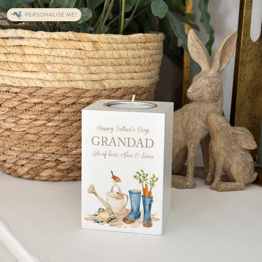 wooden cuboid luxury tealight holder with gorgeous personalised options . Each product is lovingly designed, handmade with our Countryside inspired watercolour designs. This design features blue wellies, carrots, a robin sitting on a brown watering can and some gardening gloves. unique designs for a truly one off special occasion for a loved one- The perfect memorial gift. 