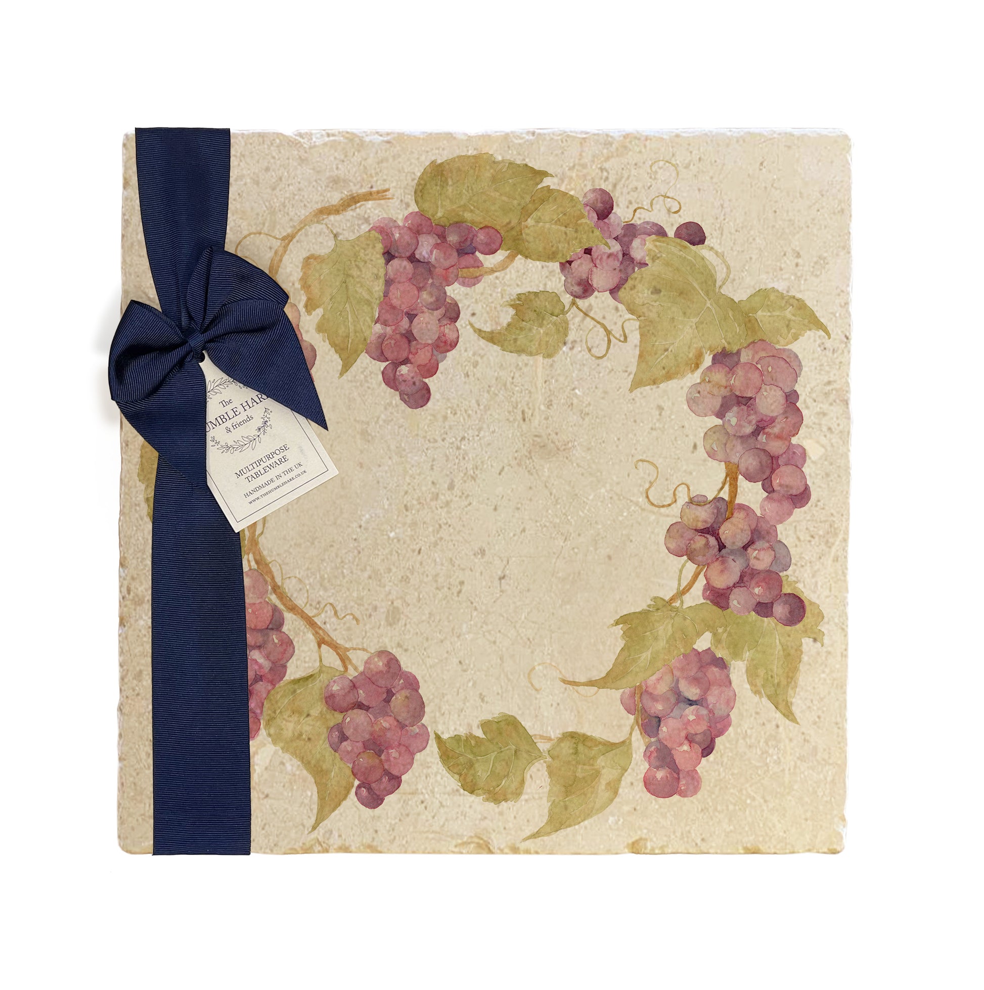 A large multipurpose marble platter with a watercolour grape vine wreath design, packaged with a luxurious dark blue bow and branded gift tag.