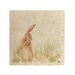 A square cream multipurpose marble platter, featuring a watercolour design of a hare washing his ear.