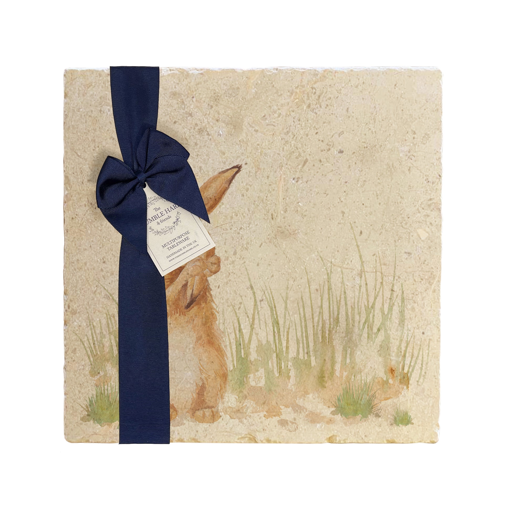  A multipurpose marble platter with a design featuring a hare washing his ear, packaged with a luxurious dark blue bow and branded gift tag.