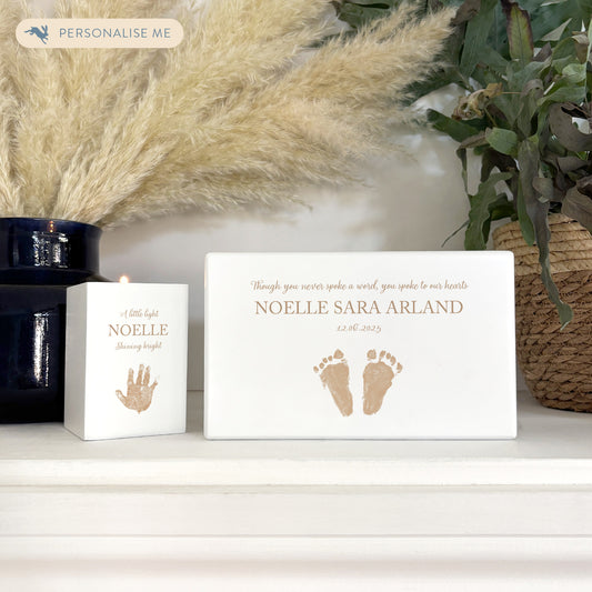 A beautifully crafted solid wooden urn, finished in white with a soft watercolour design of baby's handprints and footprints, Thoughtfully made for either display or burial, this personalised urn can be customised to create a meaningful memorial. Perfect for holding ashes of a loved one or a beloved pet, it serves as a comforting tribute and keepsake. Helping with baby loss