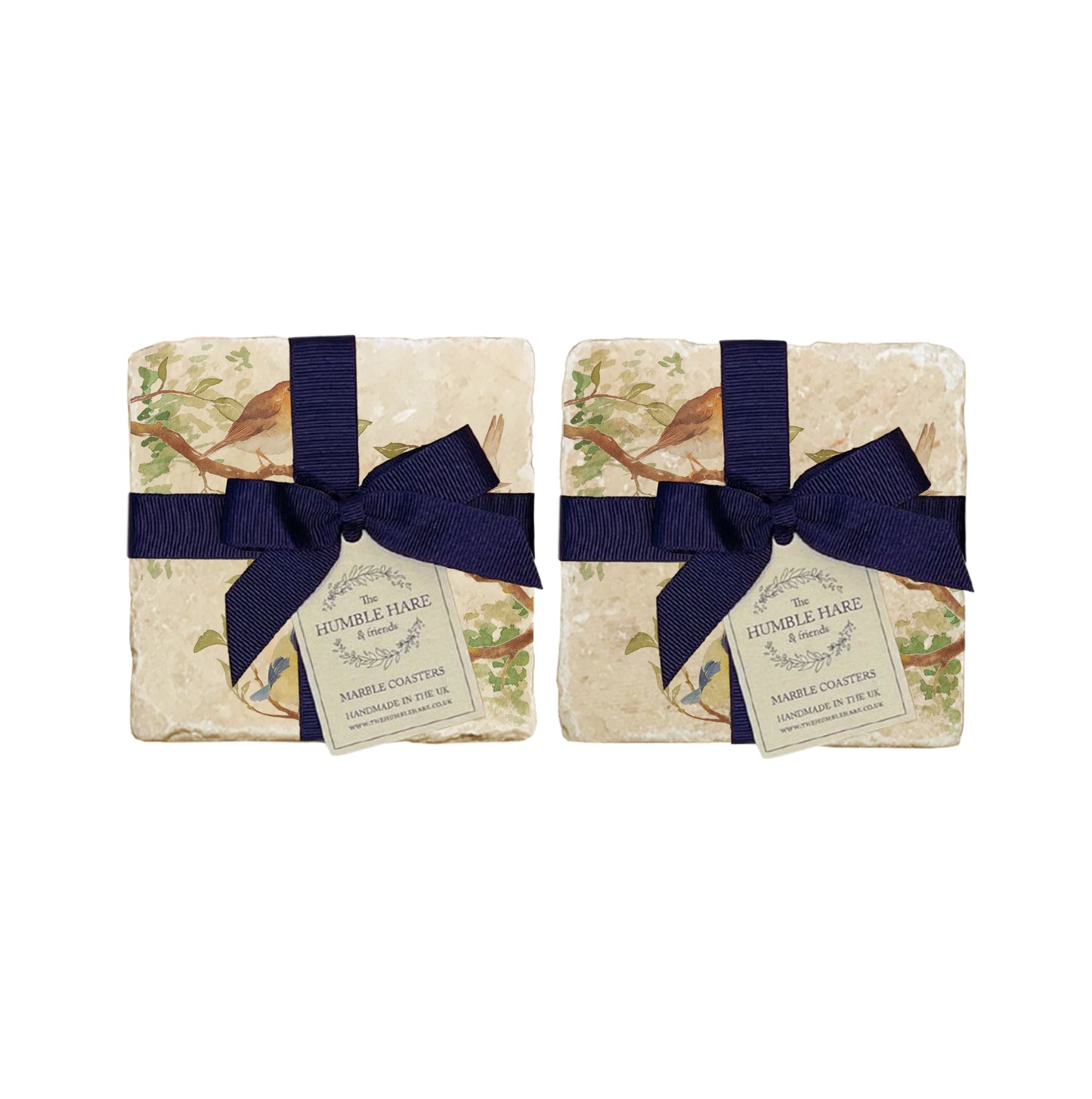 A set of 4 handmade marble coasters packaged in 2 pairs, with a luxurious dark blue bow and gift tag.