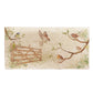 A handmade rectangle cream marble splashback tile featuring a watercolour countryside animal design  of garden birds surrounding a paddock gate.