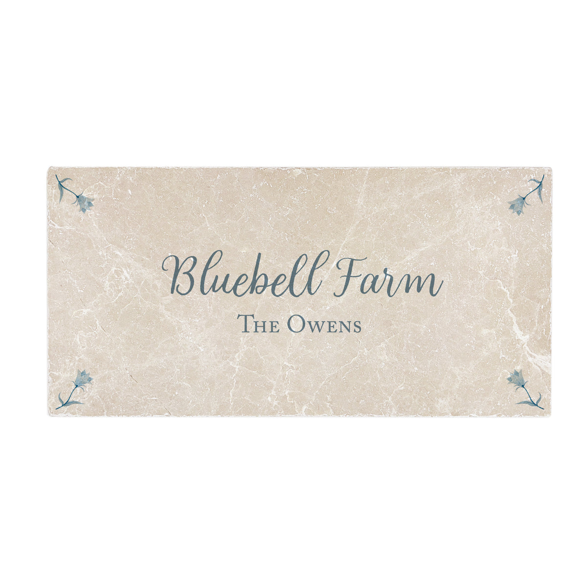 Marble tile in a cream colour with personalised text. 