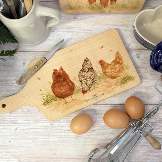 Handmade paddle board in Beech wood, featuring a water colour Hen design with a hand tied luxury blue ribbon. perfect chopping board, charcuterie board, serving board and chopping board. 