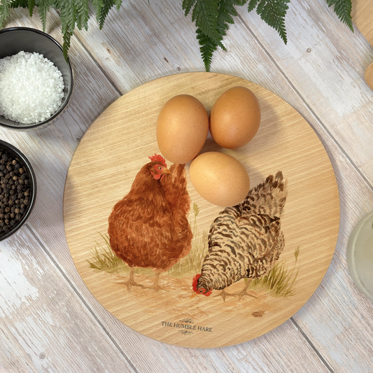 Decorative round Beech chopping board with Hens artwork and luxury blue ribbon to finish.