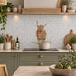British countryside marble mural above a traditional range cooker, featuring a highland cow 