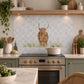 British countryside marble mural above a traditional range cooker, featuring a highland cow 