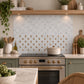 Mosaic splashback tile with a detailed watercolour Highland Cow portrait.