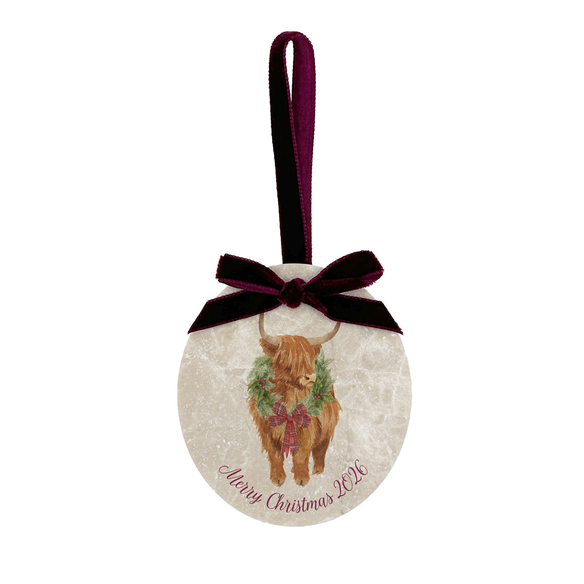 An oval marble Christmas ornament featuring a Highland cow wearing a green wreath, with personalised text reading 'Merry Christmas 2026' written below. The ornament has a dark burgundy velvet ribbon and bow hanging loop at the top, set against a plain white background.