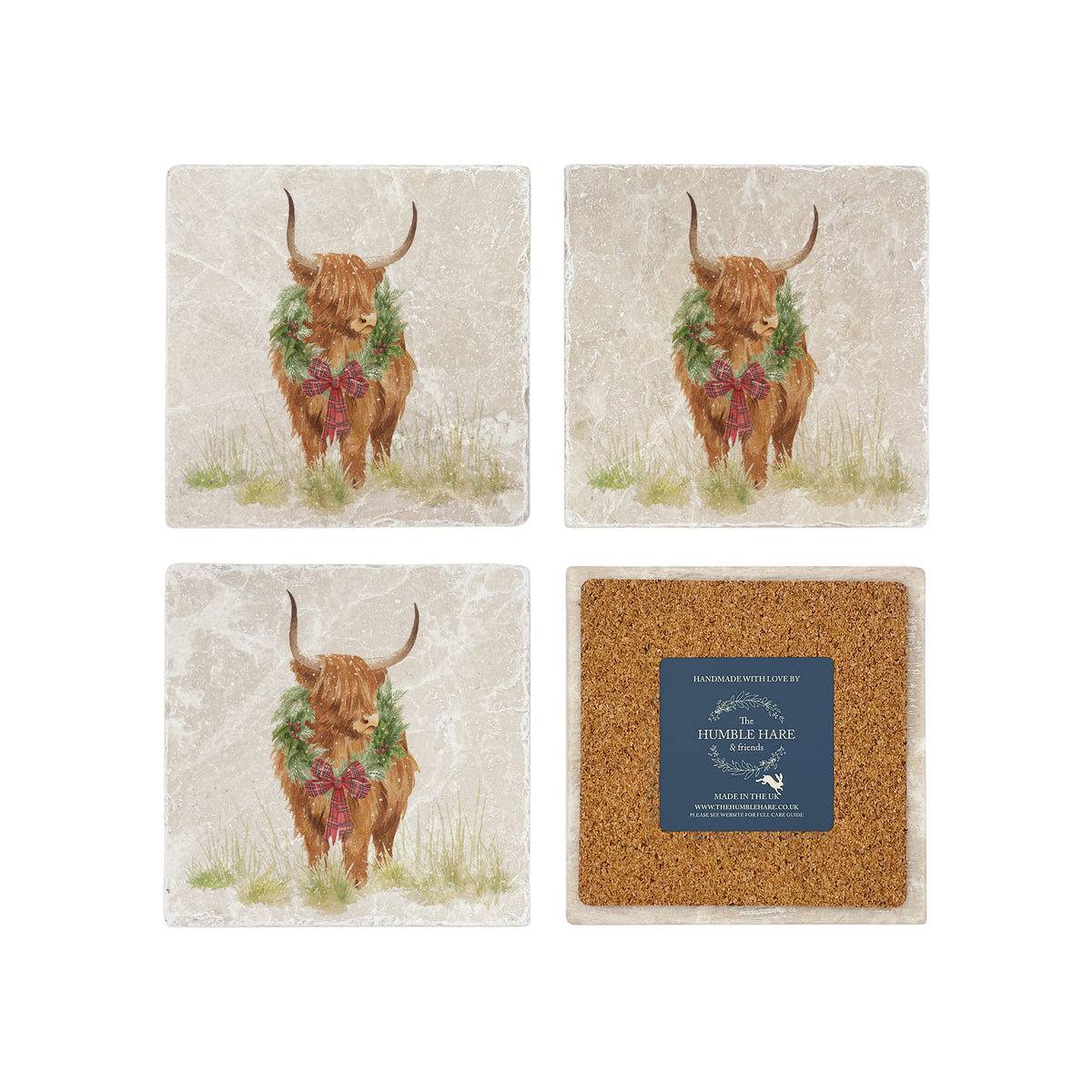 Set of four square marble coasters featuring a watercolour illustration of a Highland cow wearing a green wreath with red tartan bow. One coaster is flipped to show the back is covered with cork to protect furniture.